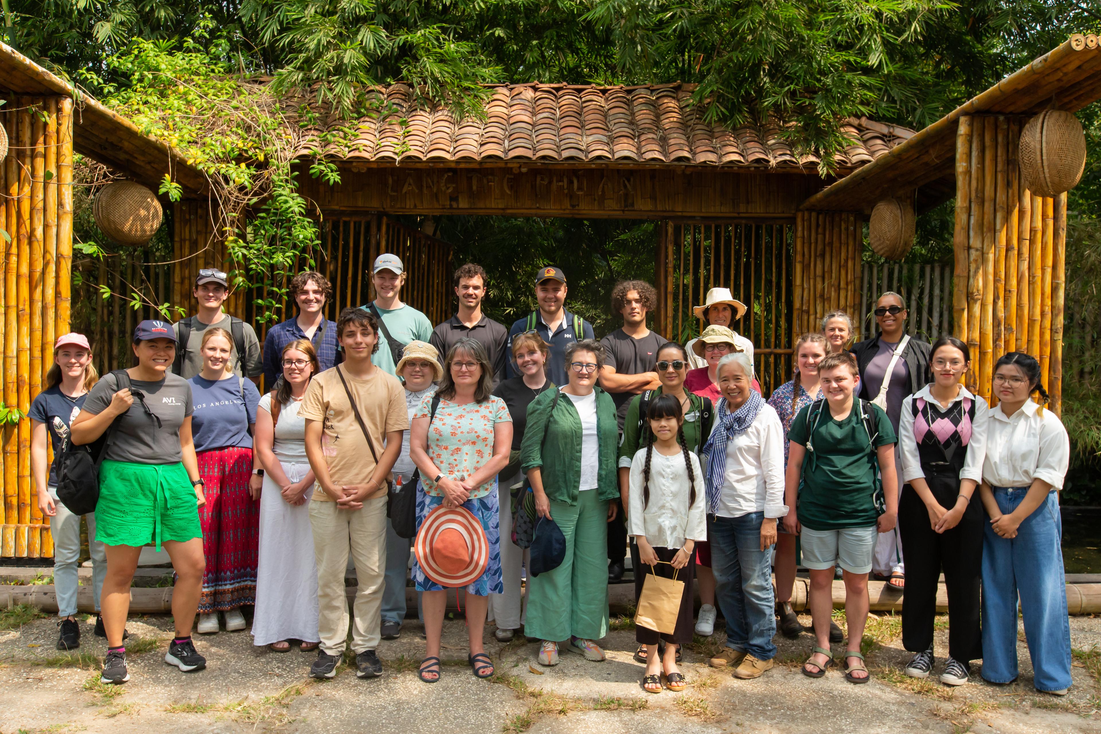 SEASIA Travel group tour guests at a bamboo house