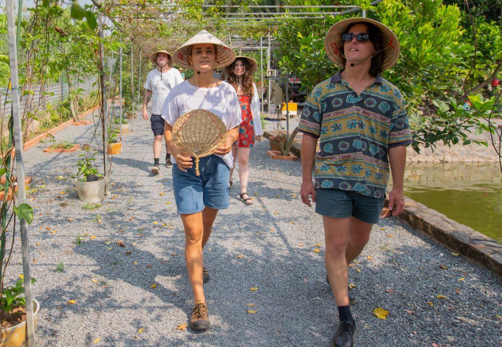 Guests walking through a Vietnamese village
